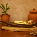 Sleeping buddha on tree bark figurine