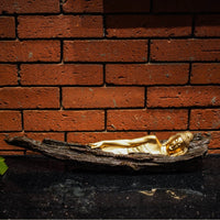Sleeping buddha on tree bark figurine