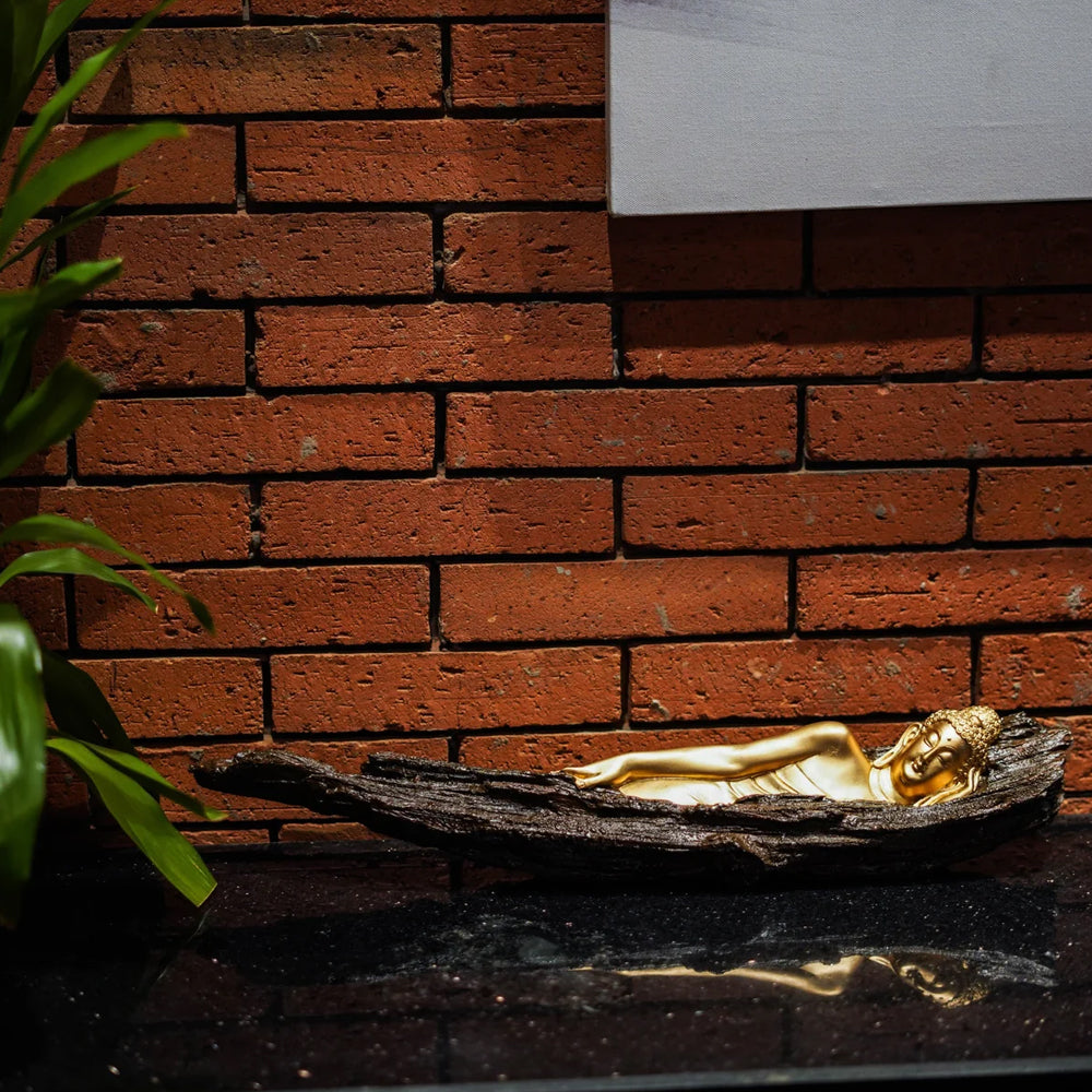 Sleeping buddha on tree bark figurine